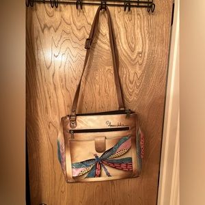 Anuschka purse. Can be worn on shoulder or as a cross body. Excellent condition